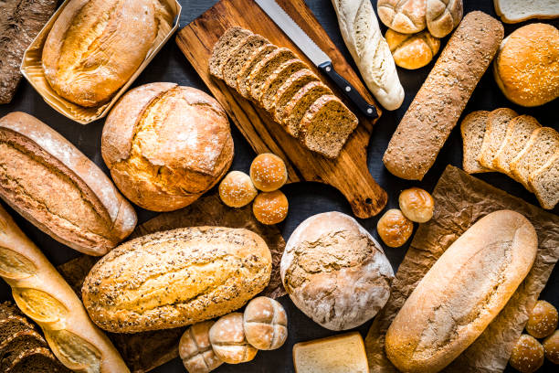 Assortment of fresh breads as background